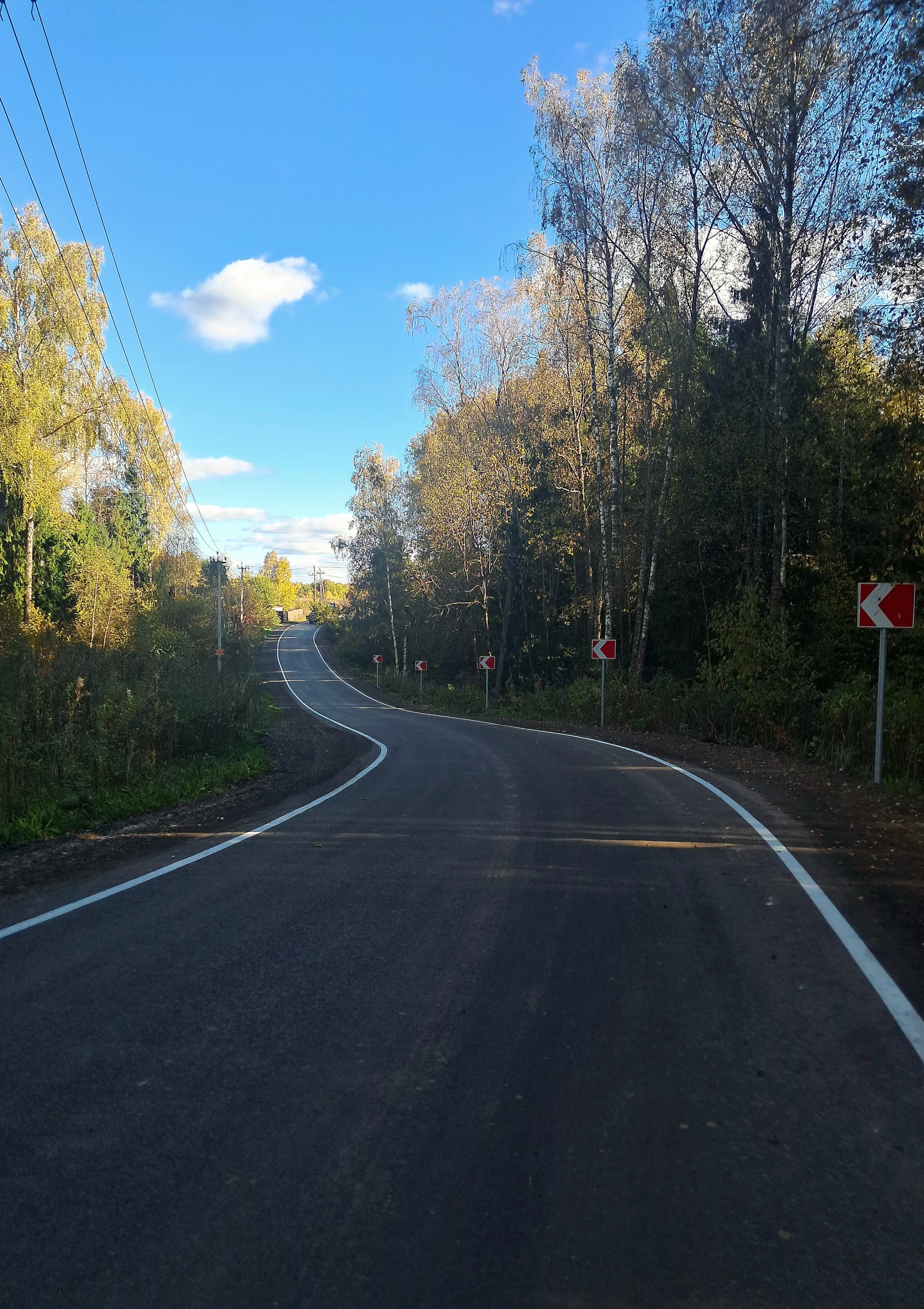 Событие века - у нас проложили асфальтовую дорогу